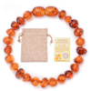 Bracelet en ambre naturel pour bébés avec certificat sur fond blanc