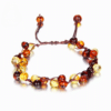 Bracelet de cheville ajustable en ambre pour adultes sur fond blanc